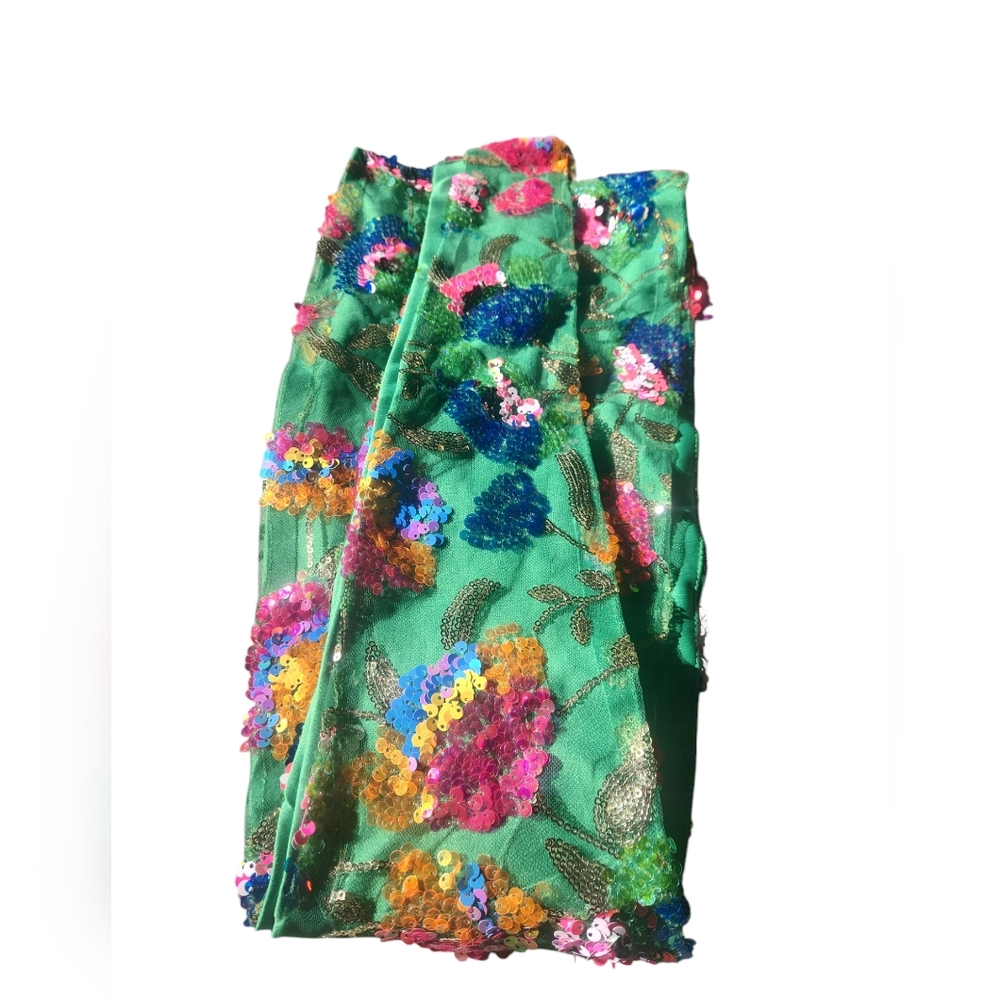 Sequined green scarf. Can also be used as a belt. Measures at 69 inches.